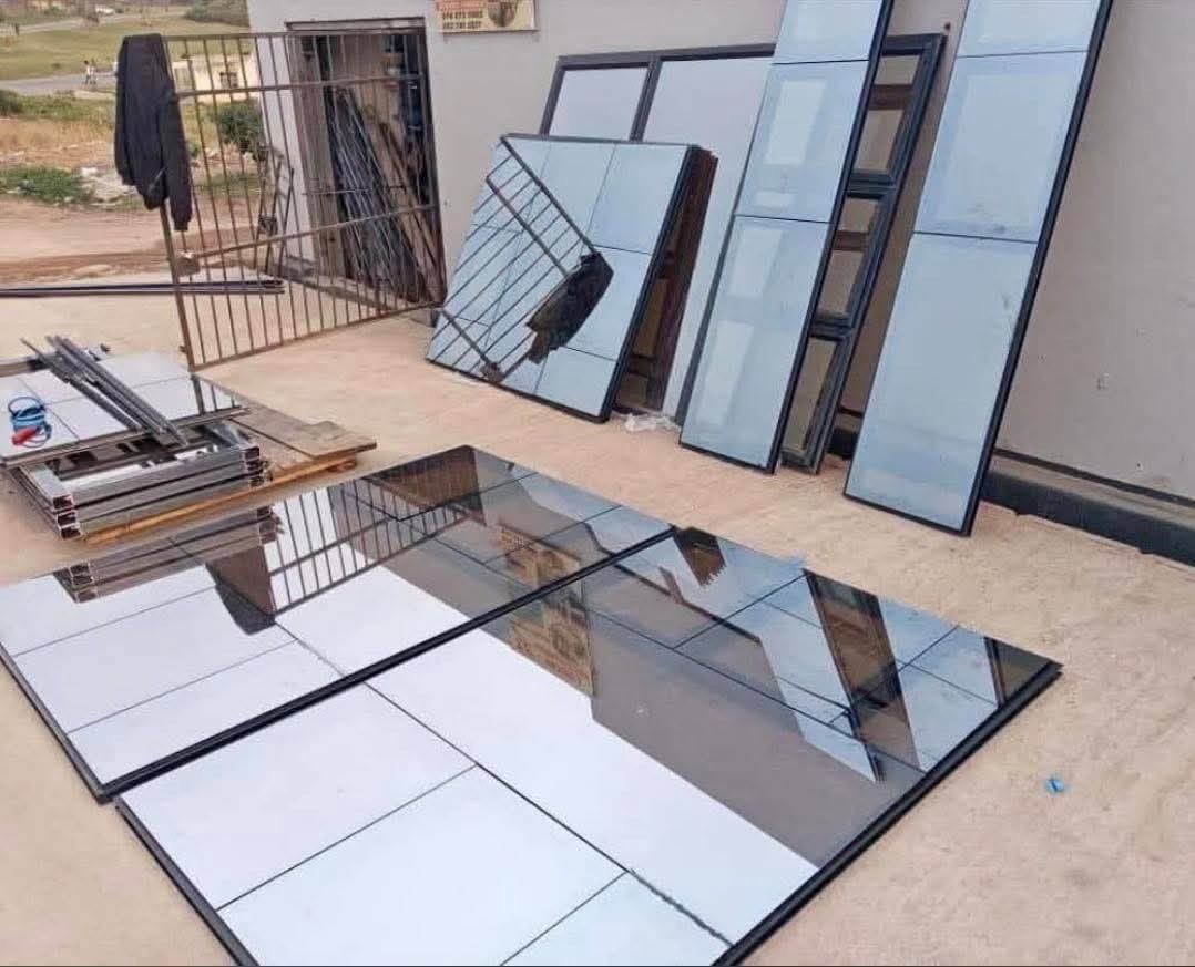 Aluminium and glass panels laid out during fabrication