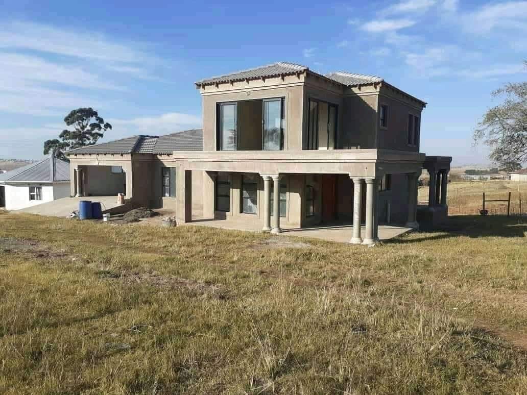 Double-storey house under construction with balcony