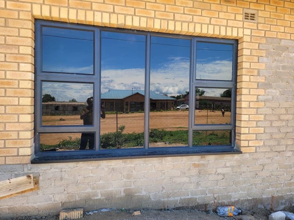 Large tinted window in finished brick wall